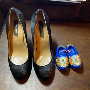 Worn, yet still looks as a brand new. It was holiday collection shoe